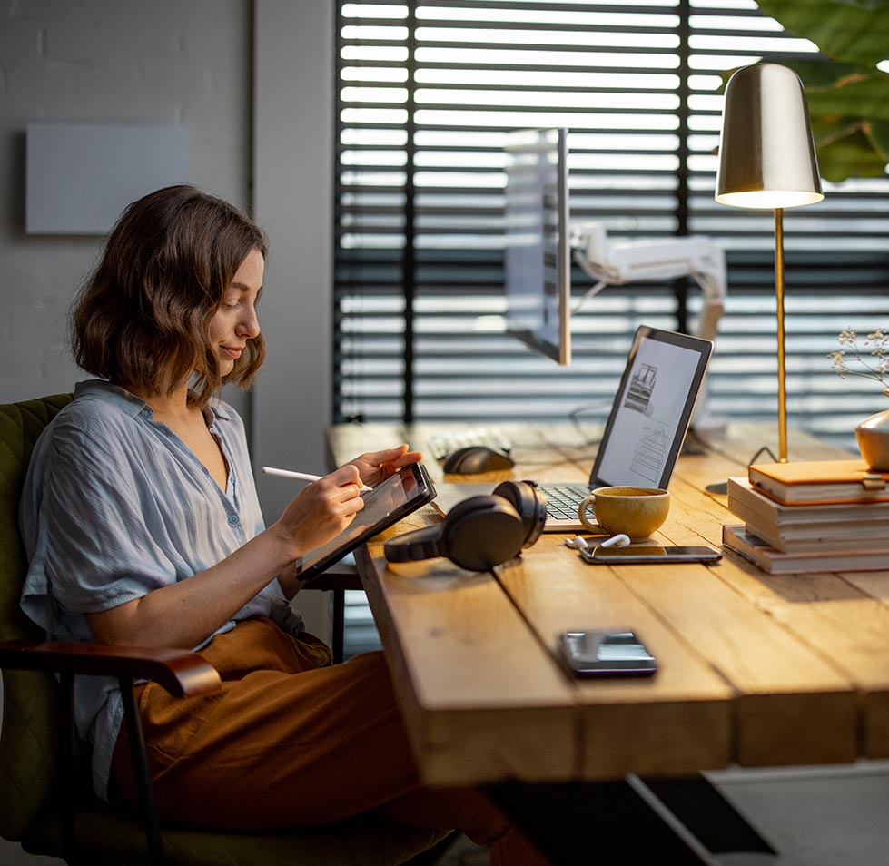 creative-woman-with-a-digital-tablet-at-home-office